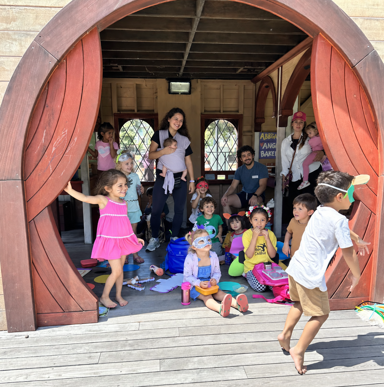 Children sharing their characters on the playground stage.