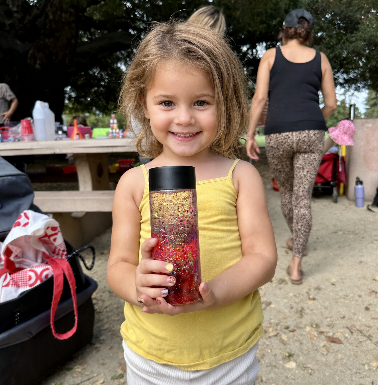 A child with a completed sunset bottle.