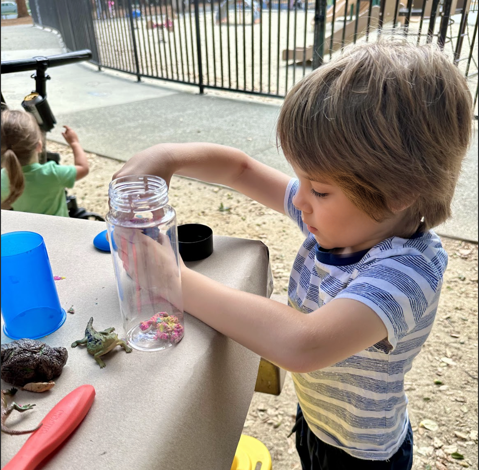 Adding materials to a sunset bottle.