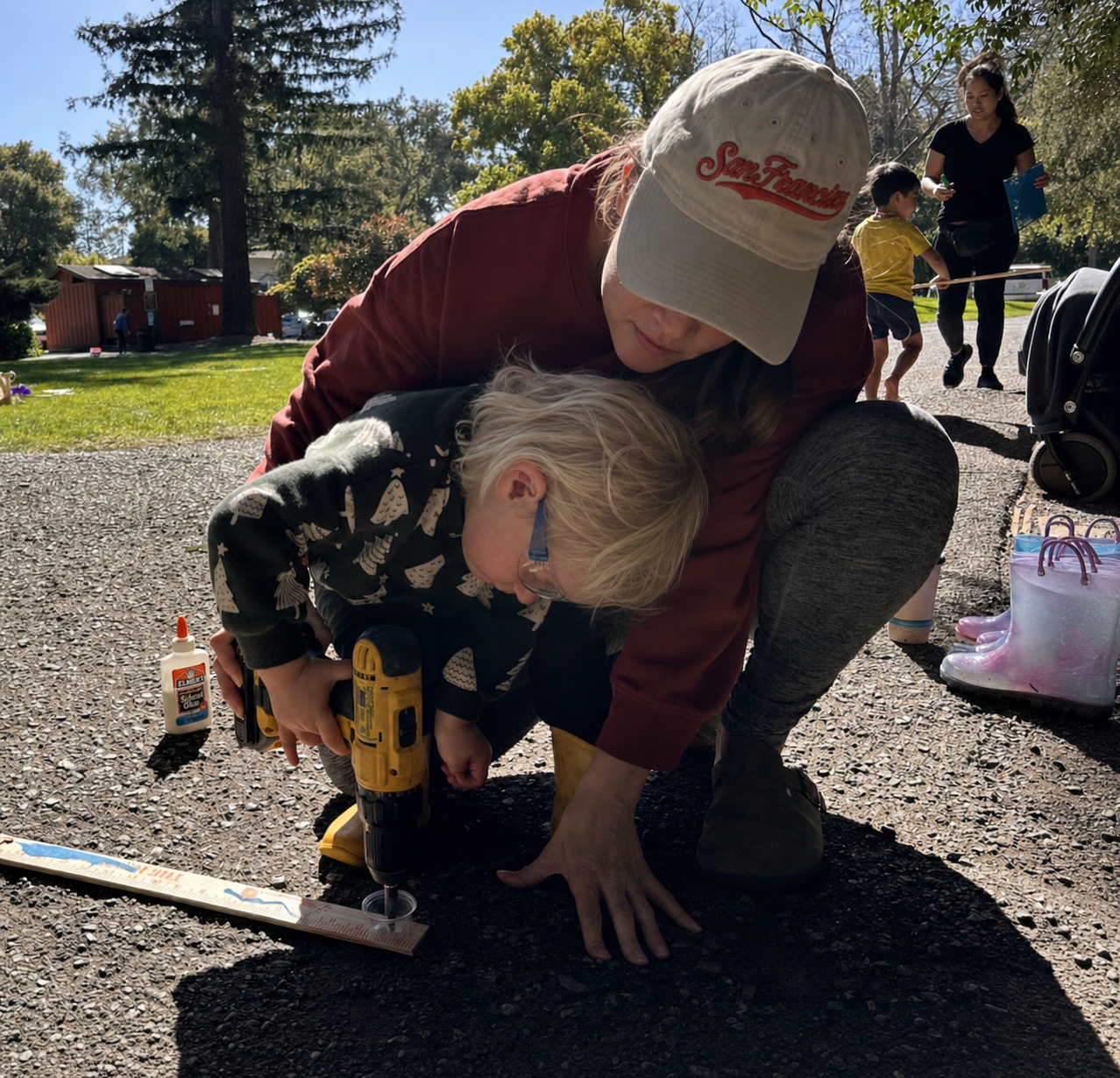 Using a drill with adult support during construction.