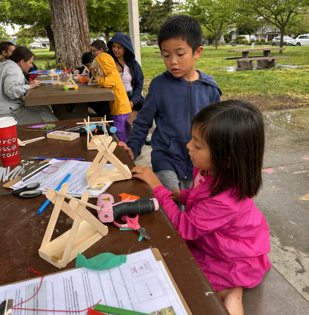 Working together on the trebuchet build.
