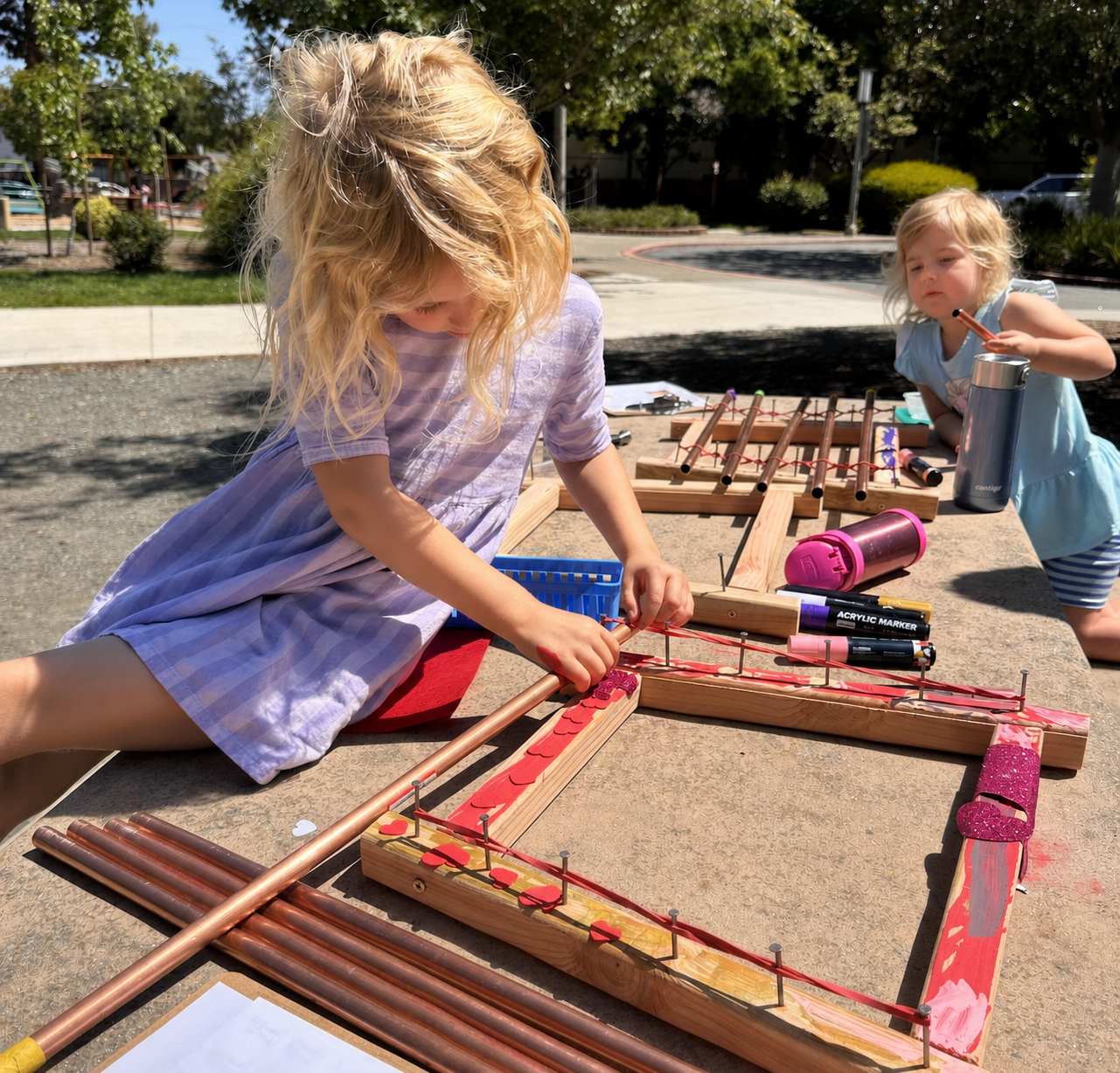 Arranging and testing the xylophone pipes.